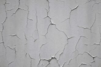 Close-up of a thin crack on a painted interior wall