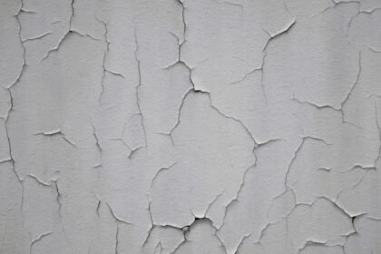 Close-up of a thin crack on a painted interior wall